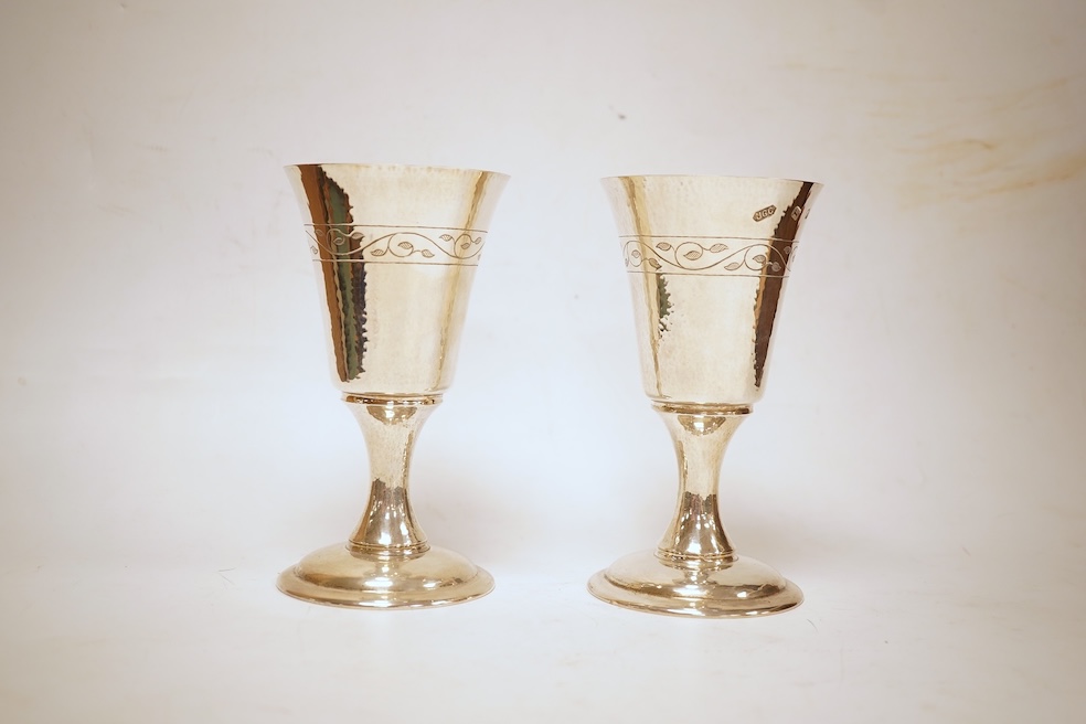 A pair of modern silver Lincoln Cathedral commemorative chalices, no.75 & 76, by John Cussell, London, 1977, 14.7cm, 13oz.